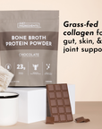 Bag of Just Ingredients bone broth protein powder with a chocolate bar and candle on a beige background